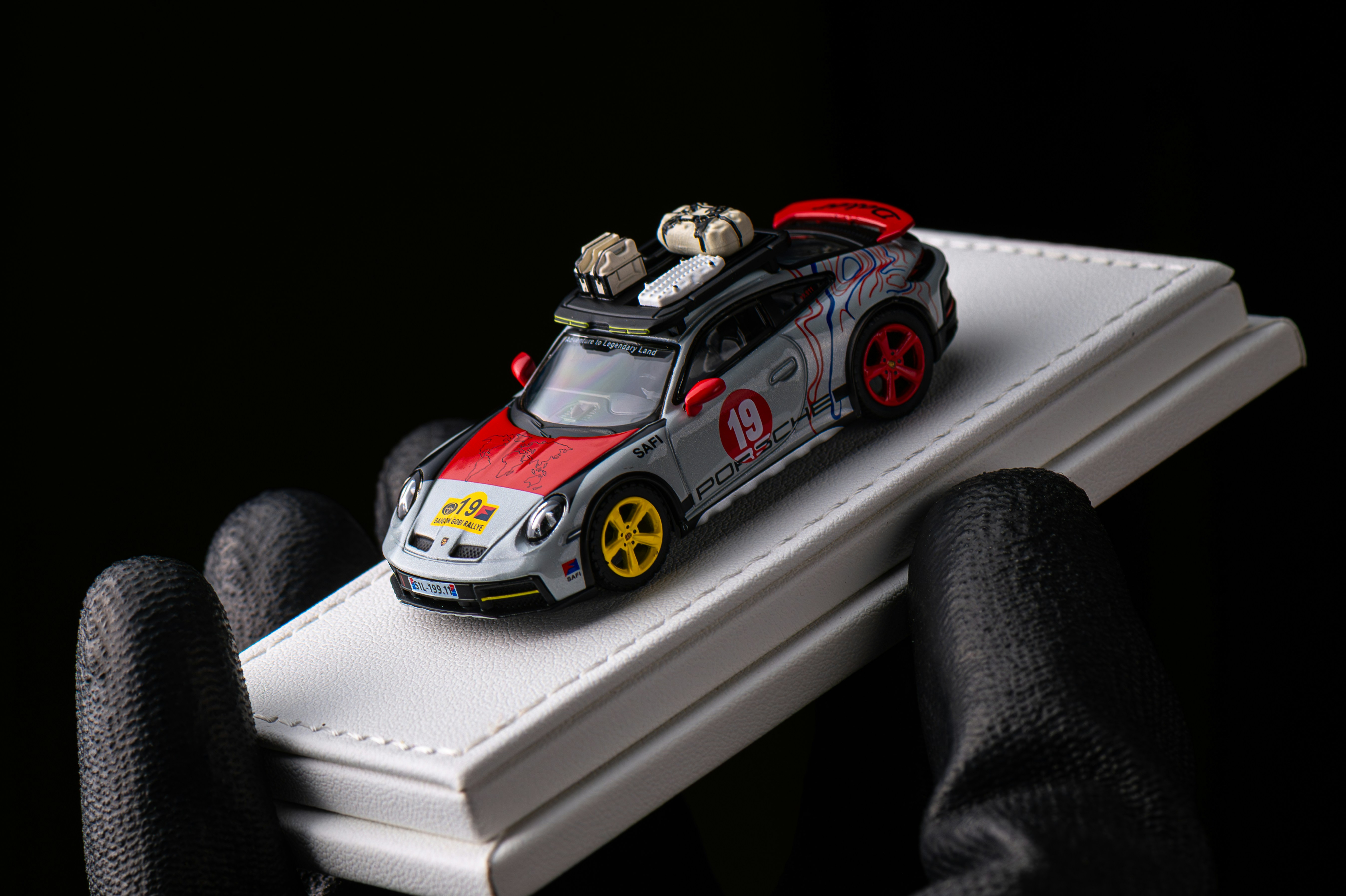 Detailed collectible sports car model in a dark studio